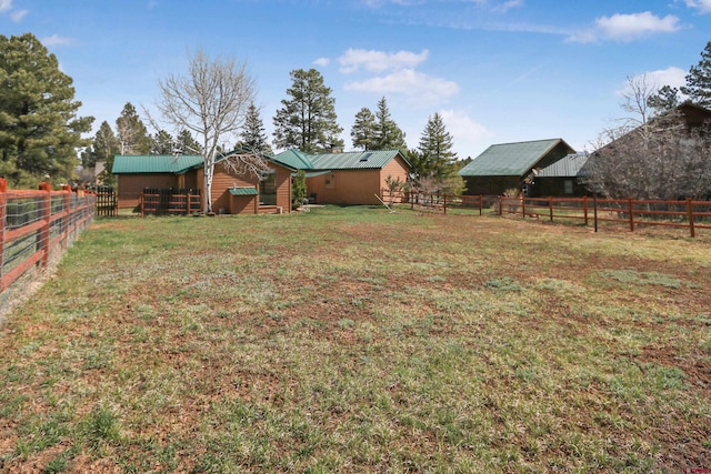 136 Trappers Dr, Pagosa Springs, CO 81147 - view of yard featuring fence and an outbuilding