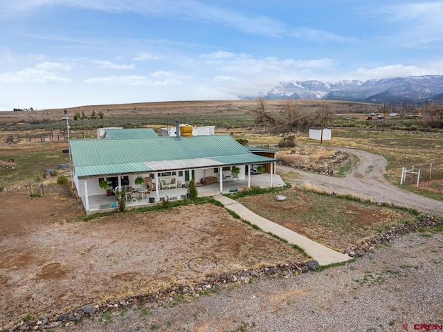 birds eye view of property featuring a rural view and a mountain view