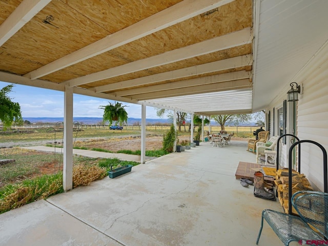 view of patio featuring outdoor dining area