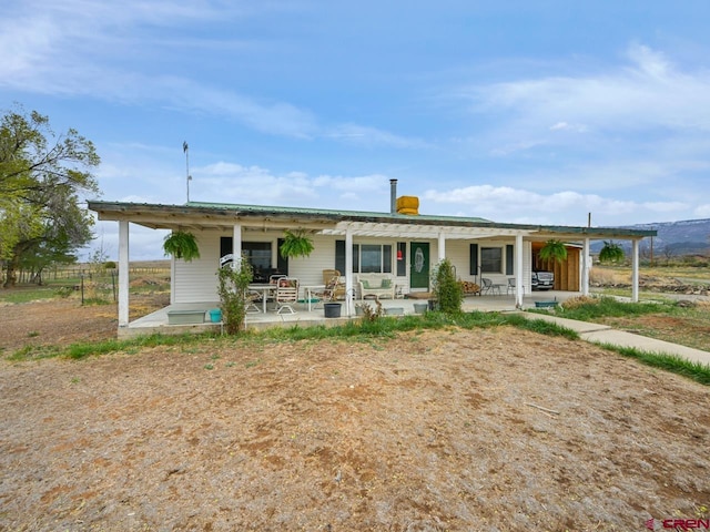 back of property featuring a patio area