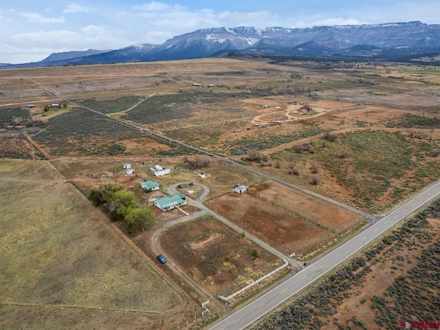 birds eye view of property featuring a rural view and a mountain view
