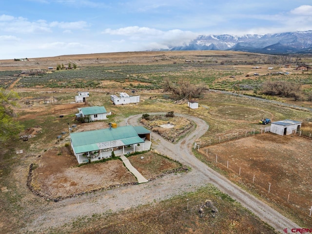 birds eye view of property with a rural view and a mountain view