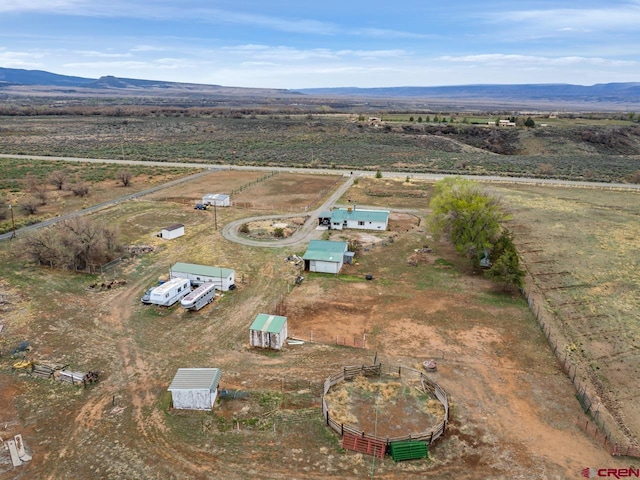 drone / aerial view with a mountain view and a rural view
