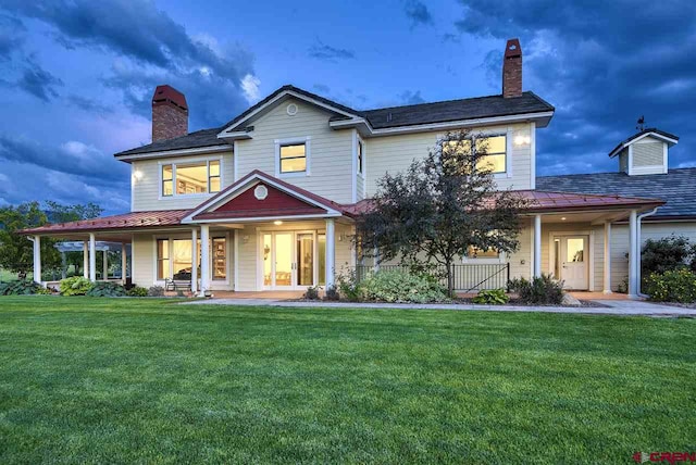 3575 E Rd, Palisade, CO 81526 - view of front of property with a chimney, a front lawn, and a porch