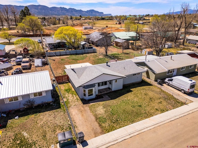 aerial view of residential area featuring a mountain backdrop