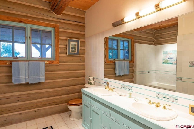 full bathroom with a sink, tile patterned flooring, double vanity, toilet, and wooden ceiling