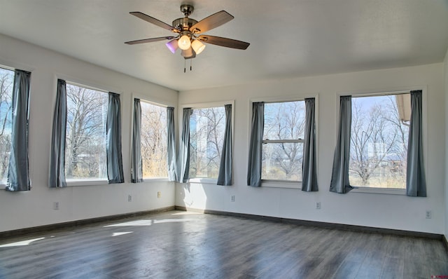 5380 4.9 S, Alamosa, CO 81101 - unfurnished room with baseboards, wood finished floors, a wealth of natural light, and ceiling fan