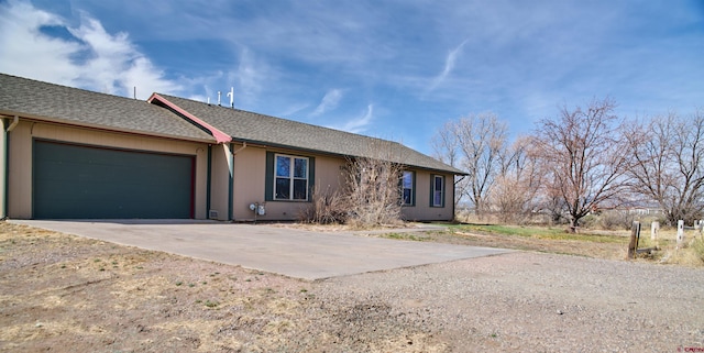 5380 4.9 S, Alamosa, CO 81101 - ranch-style home with driveway, roof with shingles, and a garage
