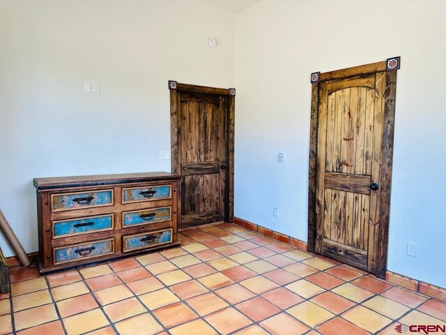 21 Hampton Run, Mosca, CO 81146 - spare room featuring baseboards and light tile patterned flooring