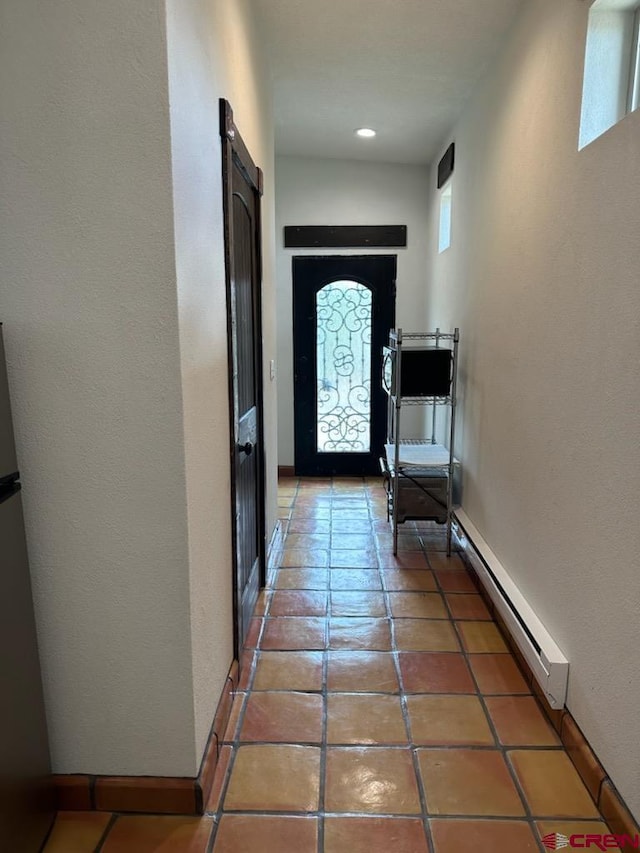 21 Hampton Run, Mosca, CO 81146 - doorway to outside with baseboard heating and light tile patterned floors