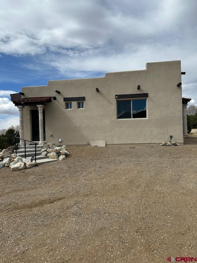 21 Hampton Run, Mosca, CO 81146 - back of property featuring stucco siding