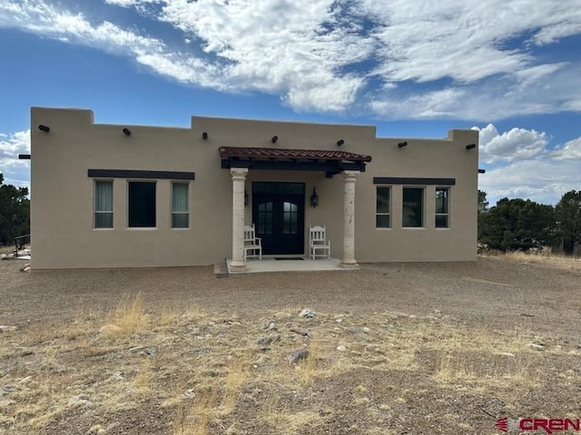 21 Hampton Run, Mosca, CO 81146 - rear view of property with a tiled roof, french doors, and stucco siding