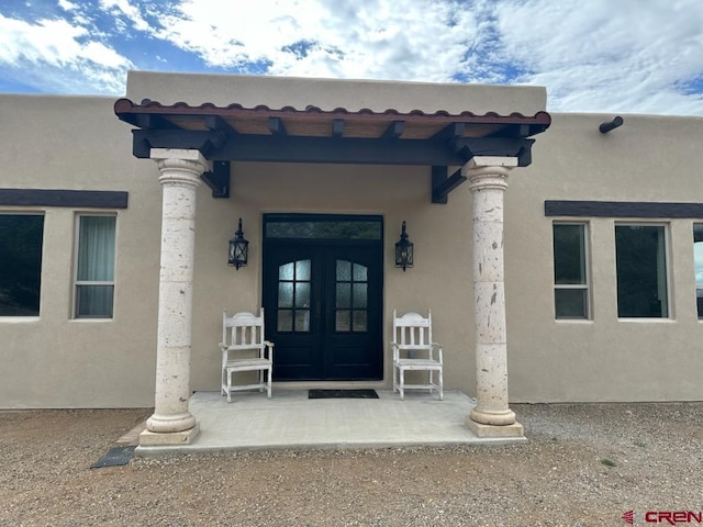 21 Hampton Run, Mosca, CO 81146 - doorway to property with french doors and stucco siding