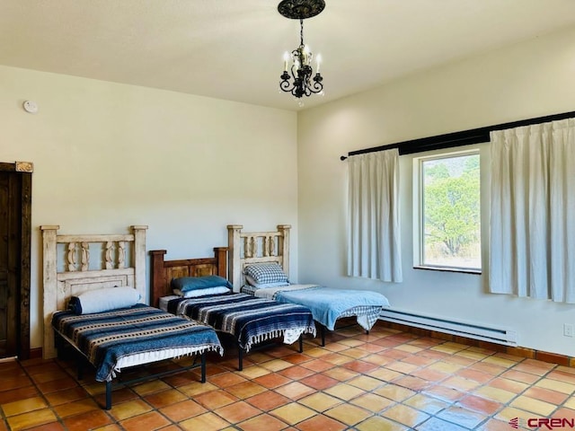 21 Hampton Run, Mosca, CO 81146 - bedroom featuring baseboard heating, an inviting chandelier, and light tile patterned floors