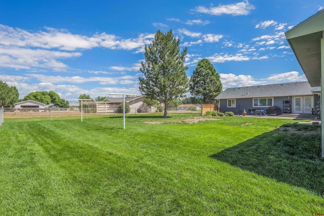 view of yard featuring fence and a patio