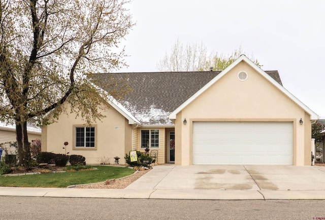 ranch-style home with stucco siding, a shingled roof, concrete driveway, and a garage