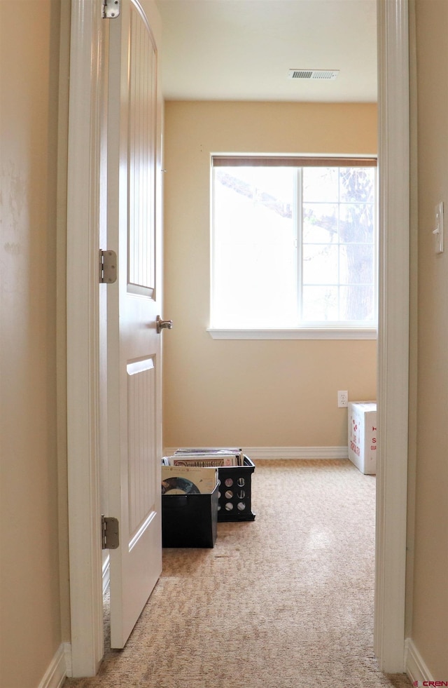 interior space with baseboards and visible vents