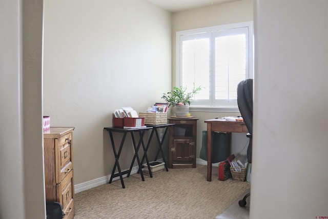 home office with baseboards and carpet floors