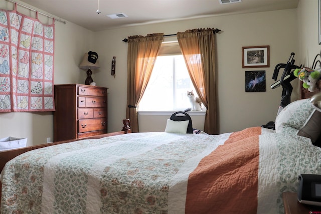 bedroom featuring visible vents