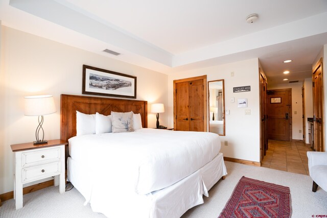 620 Gothic Rd Unit 403, Mount Crested Butte, CO 81225 - bedroom with recessed lighting, light carpet, and baseboards