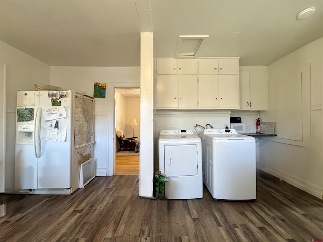 212 Bell Ave, Alamosa, CO 81101 - washroom with washer and clothes dryer, dark wood-style floors, and laundry area