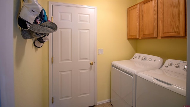 laundry area featuring cabinet space and washing machine and clothes dryer