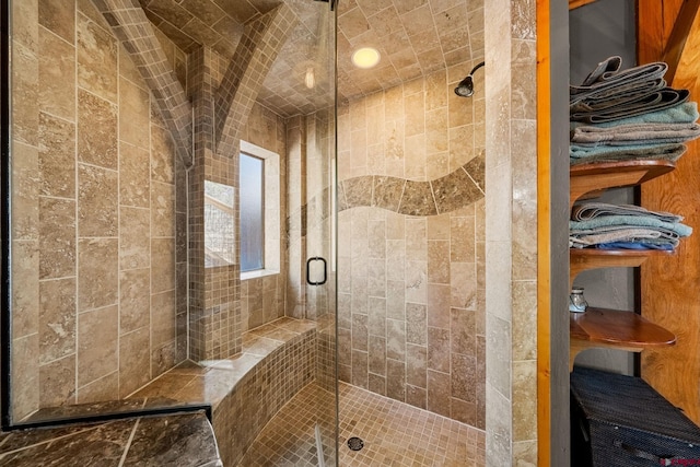 bathroom with a shower stall