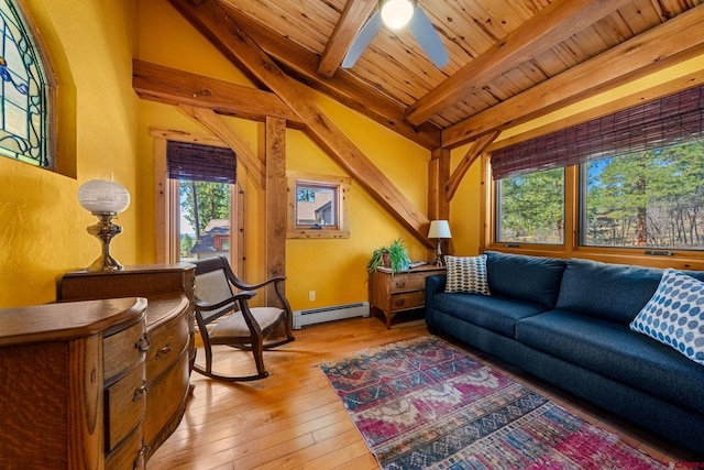 living room with a wealth of natural light, wood ceiling, light wood finished floors, and a baseboard radiator
