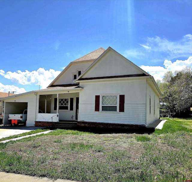 view of front of property with a carport and stucco siding