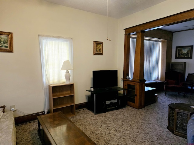 living room featuring carpet and baseboards