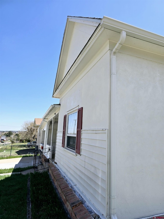 view of side of home with stucco siding