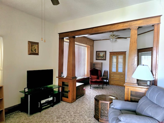 carpeted living room with ceiling fan