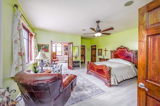 bedroom with light wood finished floors and ceiling fan