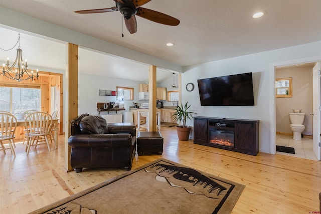 85 Mclain Ct, Pagosa Springs, CO 81147 - living room with recessed lighting, lofted ceiling with beams, light wood finished floors, and a healthy amount of sunlight