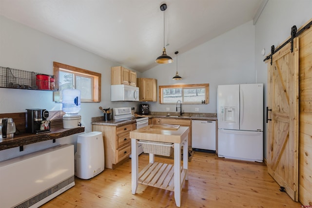 85 Mclain Ct, Pagosa Springs, CO 81147 - kitchen with white appliances, a barn door, a sink, light wood finished floors, and hanging light fixtures