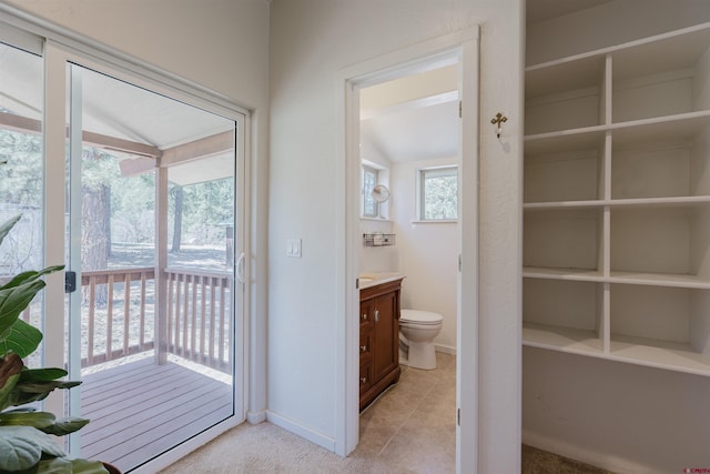 85 Mclain Ct, Pagosa Springs, CO 81147 - bathroom with vanity, baseboards, tile patterned floors, and toilet