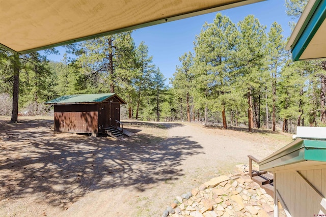 85 Mclain Ct, Pagosa Springs, CO 81147 - view of yard featuring an outdoor structure and a storage unit