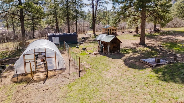 85 Mclain Ct, Pagosa Springs, CO 81147 - view of yard with an outbuilding and a greenhouse