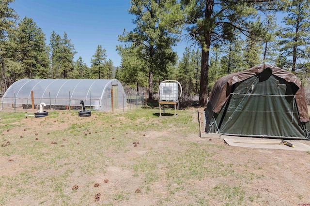 85 Mclain Ct, Pagosa Springs, CO 81147 - view of yard featuring an outbuilding and a greenhouse