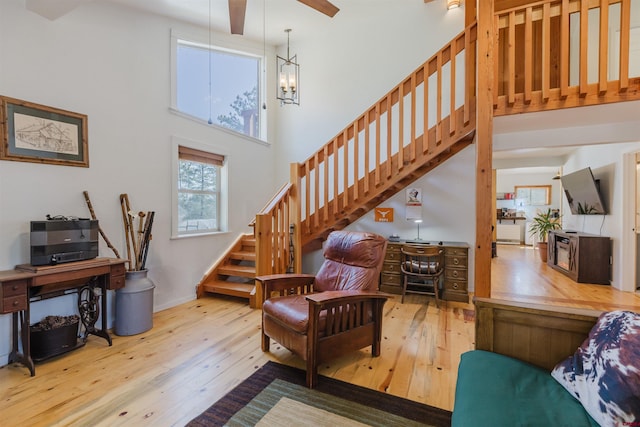 85 Mclain Ct, Pagosa Springs, CO 81147 - interior space with wood-type flooring, stairs, and a high ceiling