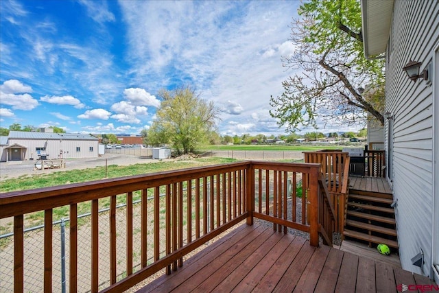 deck with a fenced backyard and a yard