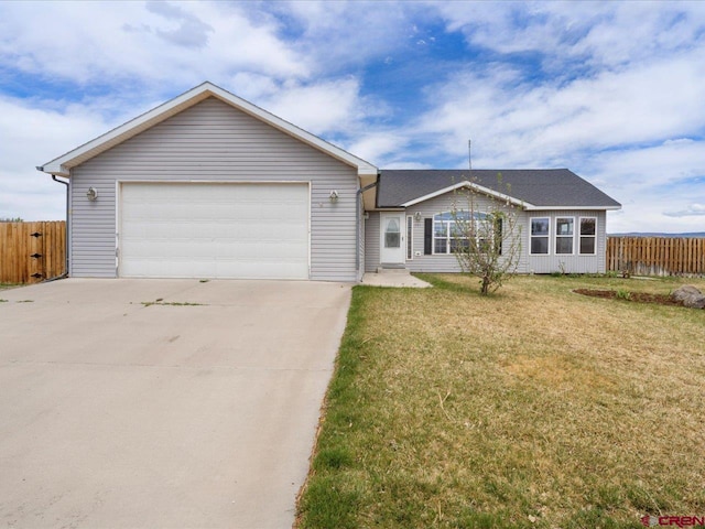 ranch-style house with fence, driveway, and a front yard