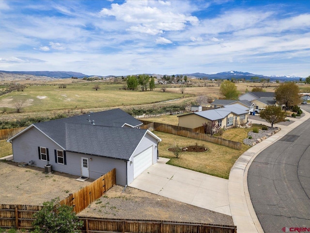 birds eye view of property with a mountain view