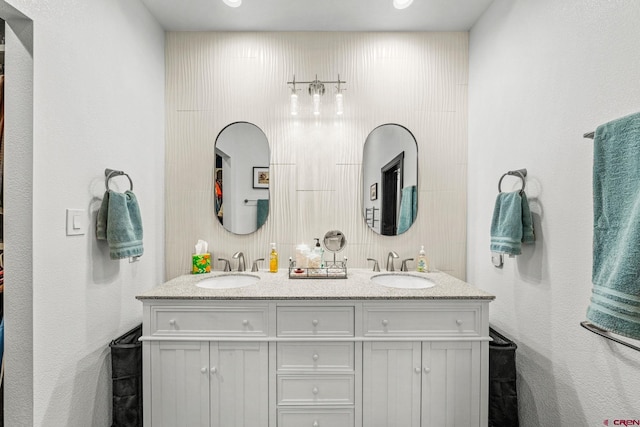 bathroom with double vanity and a sink