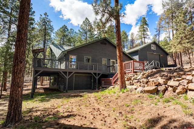 back of house with stairway and a deck
