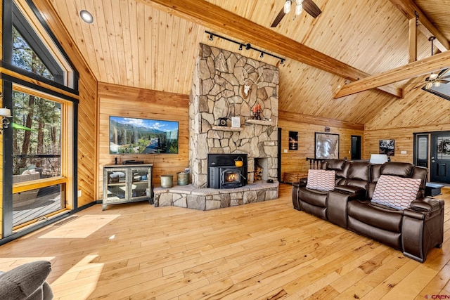 living area featuring high vaulted ceiling, a ceiling fan, and hardwood / wood-style flooring