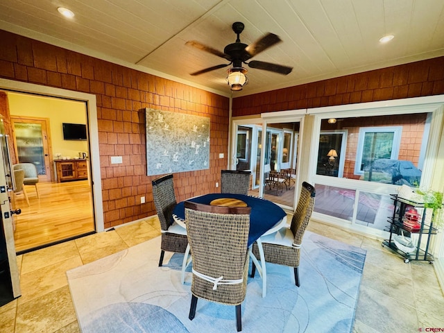 exterior space with a ceiling fan and outdoor dining space