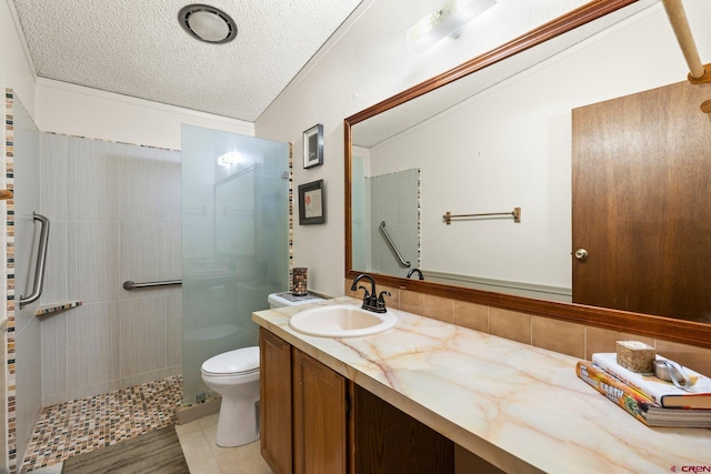 full bathroom with a textured ceiling, tasteful backsplash, vanity, toilet, and tiled shower