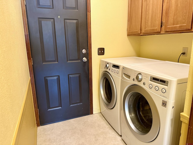 laundry area with cabinet space and washing machine and dryer