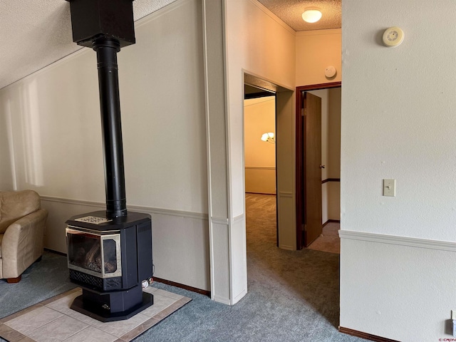 details with carpet floors, a wood stove, and a textured ceiling